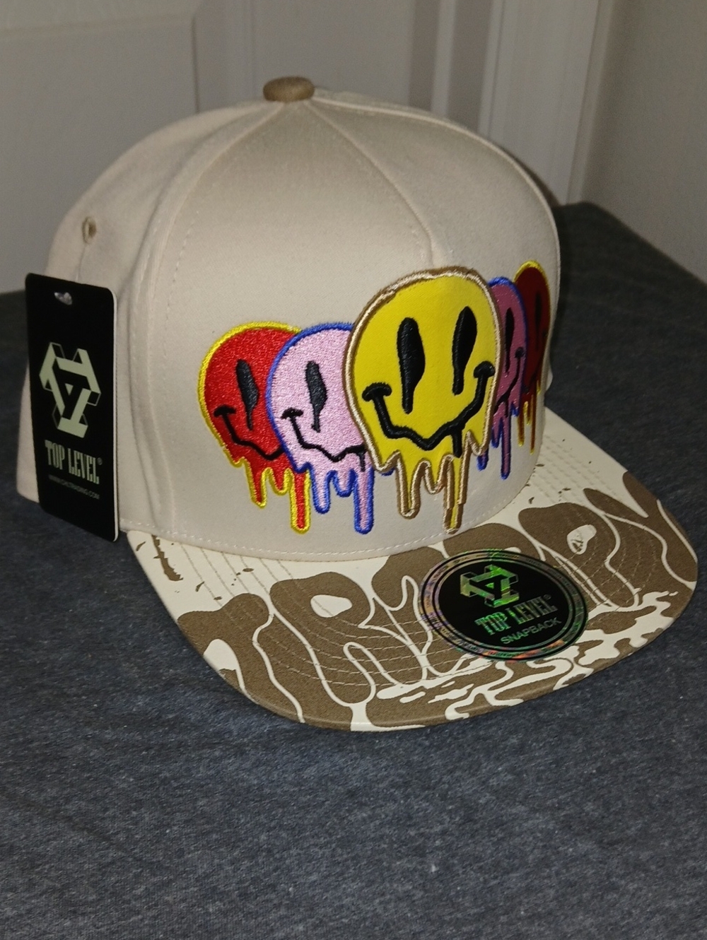 Top Level Beige Snapback Hat with Multicolor Drip Smile Embroidery